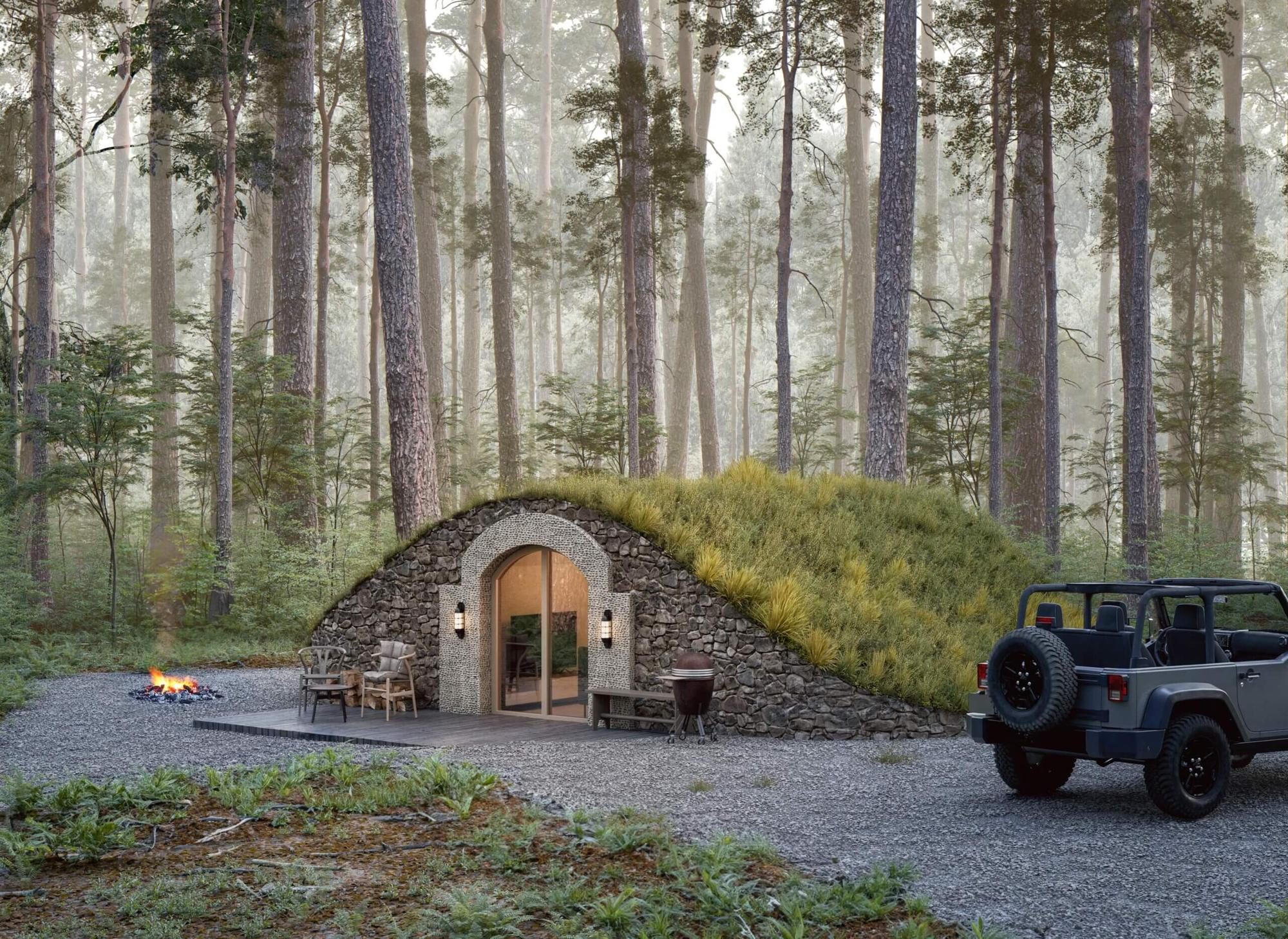 Insulated garden pod: stone-arched small living space set into a landscaped garden