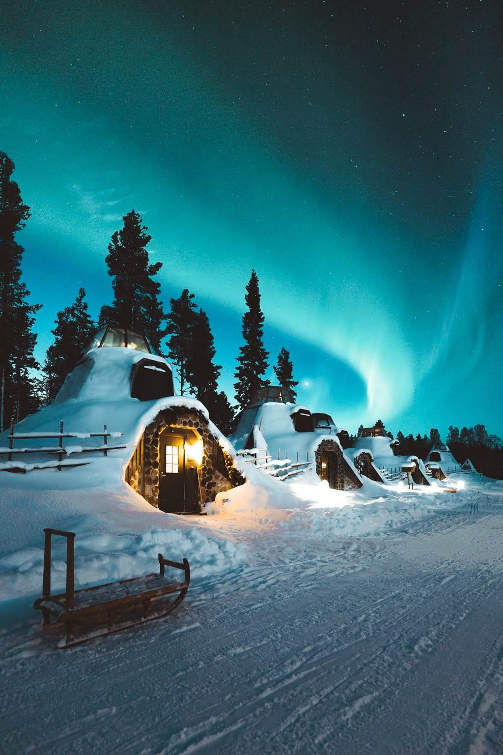 Modular A: snow-covered pods under the northern lights, inspired by Finnish Mökki houses